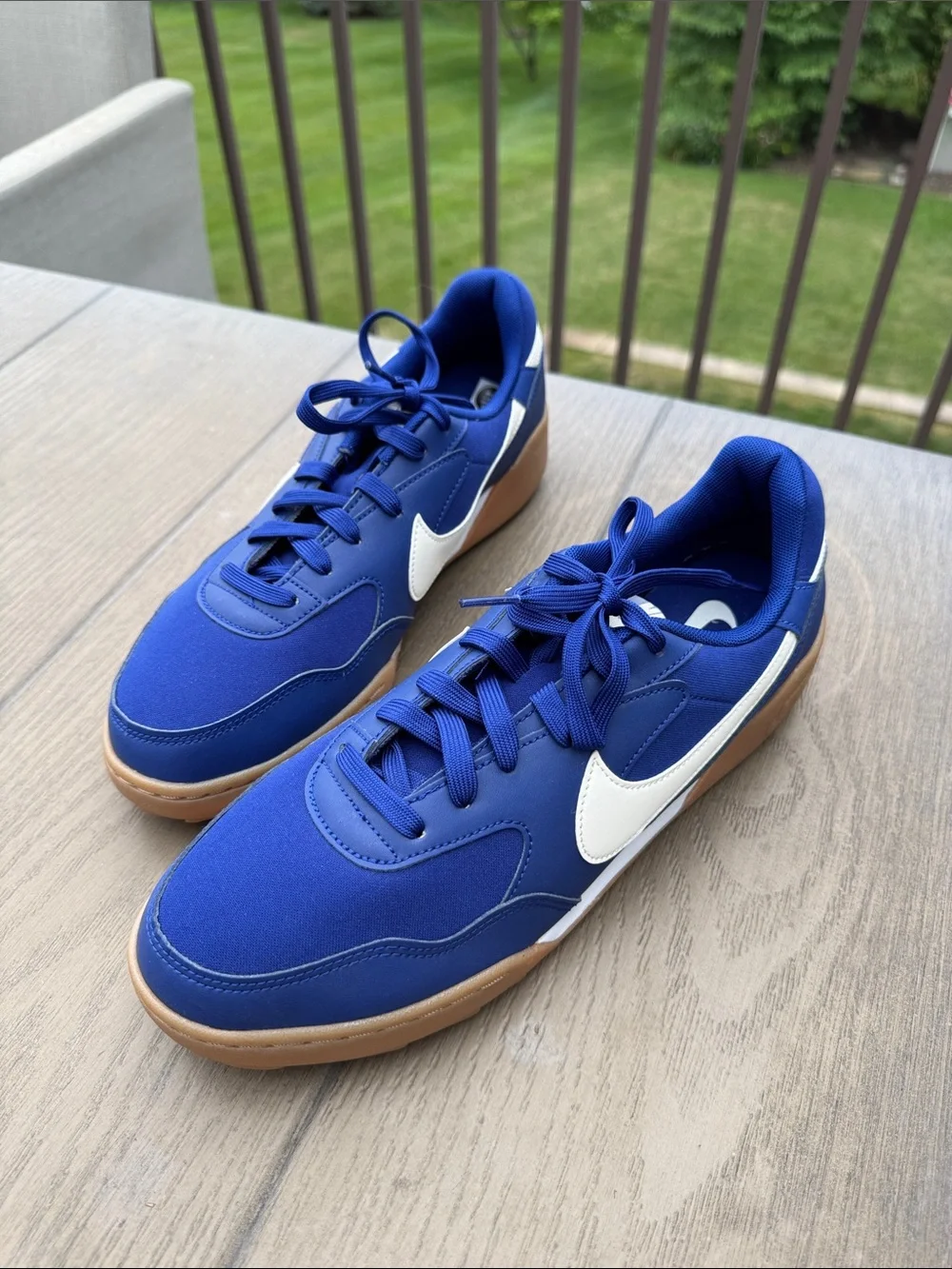 Nike Blue Sneakers with White Swoosh and Gum Sole